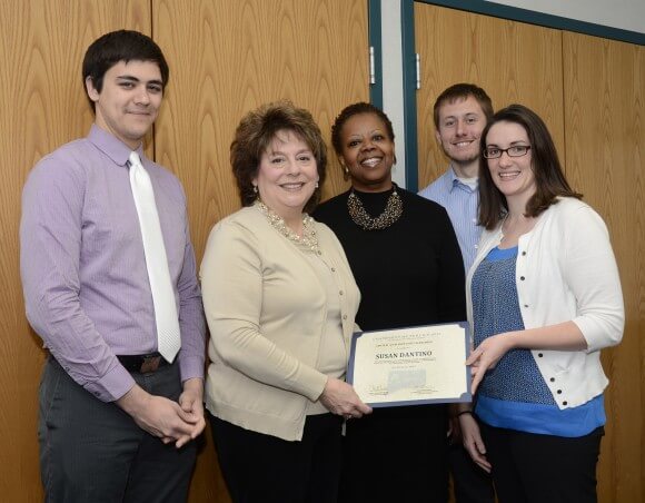 Susan Dantino (second from left) received the award from VISTA program manager Katie Coutu. They are shown with (left to right) Brandon Cirillo, VISTA leader, Kimberly James, Tunxis VISTA site supervisor, and Sam Rigotti, VISTA leader.