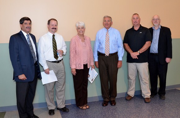 In photo L to R with Tunxis President Cathryn L. Addy, Ph.D. and director of facilities John Lodovico (both in center) are: John Cavacas, CT DAS Division of Construction Services; Peter Simmons, CT DAS Division of Construction Services; Warren Breece, W.J. Mountford Co.; and Kevin Kerchaert, AIA, Techton Architects Inc.