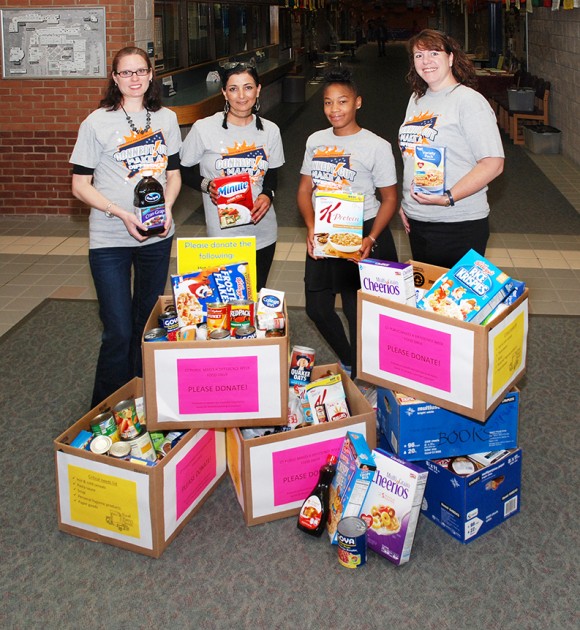 (L to R): Tunxis faculty and staff Marie Clucas, Ph.D., Behnaz Perri, Ashley Foster and Susan Winn were among a group who helped organize a food drive for Plainville Community Food Pantry during “Connecticut Publics Make a Difference Week” at Tunxis.