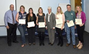 At the celebration, Victor Mitchell (left), Tunxis director of Business and Industry Services, and President Cathryn L. Addy, Ph.D. (fourth from right) stand with certificate recipients (l to r) Stacey Marsh; Lori Vallee; Stefany Kahle; Meg Appicelli, Kurt Suydam; and Barbara DeLoureiro. 